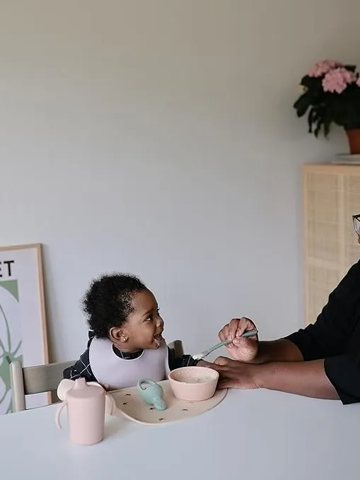 Mushie - śliniak silikonowy z kieszonką Pale Mauve