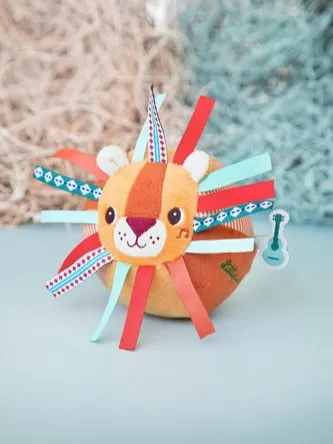 Lilliputiens - piłeczka sensoryczna z dzwoneczkiem i wypustkami Lew Jack