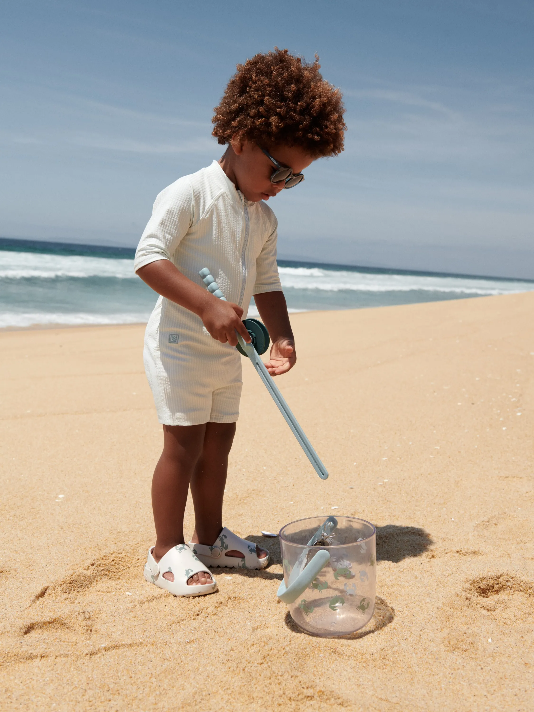 Liewood - kombinezon kąpielowy z krótkim rękawem UV Max Seersucker pure sky creme de la creme Liewood - kombinezon kąpielowy z krótkim rękawem UV Max Seersucker pure sky creme de la creme