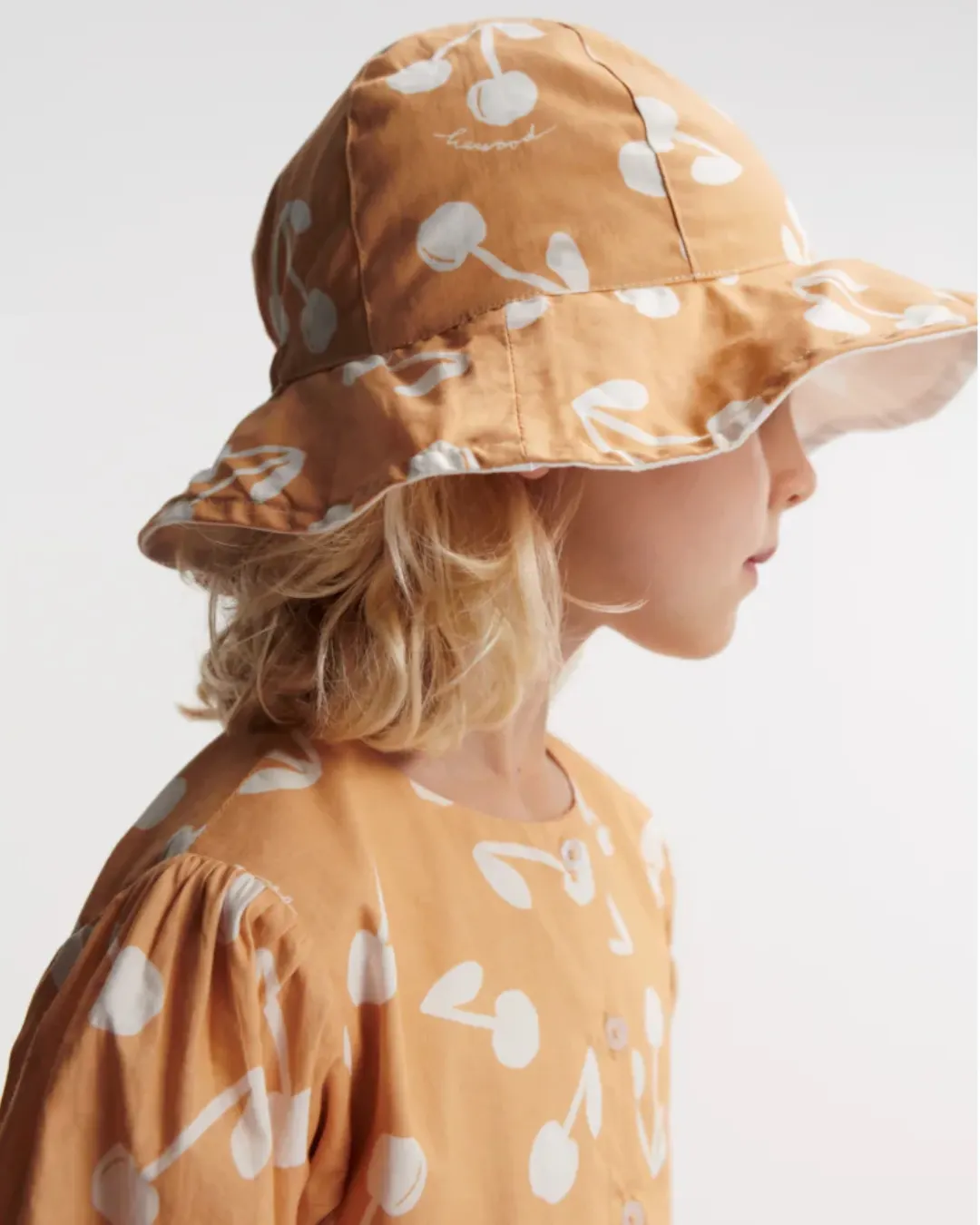 Liewood - dwustronny kapelusz przeciwsłoneczny Amelia Reversible cherry blossom light apricot